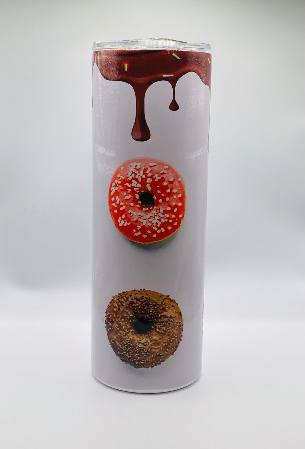 Donut Drip 20 oz skinny stainless Tumbler with lid and straw.